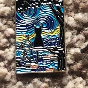May include: A black cat sits on a branch in front of a blue and yellow starry night sky. The image is a stylized version of Vincent van Gogh's famous painting, "Starry Night."