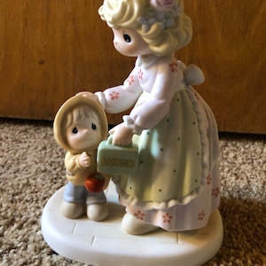 Enesco Precious Moments “Cherish Each Special Moment” porcelain figure sorry no international shipping from this shop