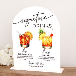 White acrylic arch bar sign UV printed with a personalized signature drinks menu featuring two cocktail illustrations, descriptions, and space for names and date. Clean and elegant, it’s ideal for weddings, bridal showers, or vow renewals.