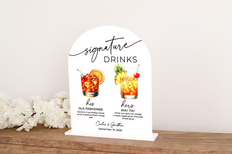 White acrylic arch bar sign UV printed with a personalized signature drinks menu featuring two cocktail illustrations, descriptions, and space for names and date. Clean and elegant, it’s ideal for weddings, bridal showers, or vow renewals.