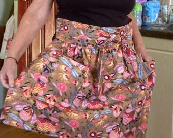 Floral Cotton Apron: High-Waisted with Long Straps. shades of mocha in the background