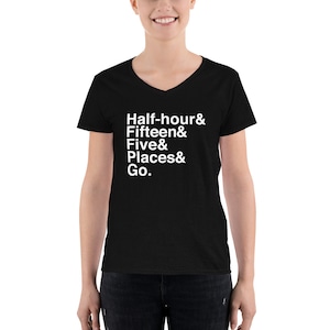 May include: Black v-neck t-shirt with white text that reads "Half-hour & Fifteen & Five & Places & Go."