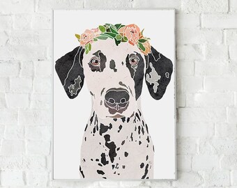 May include: A black and white Dalmatian dog wearing a floral crown with pink and green flowers. The dog is looking directly at the viewer.
