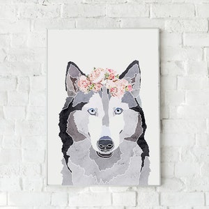 May include: A watercolor painting of a wolf's face with a pink flower crown. The wolf has blue eyes and a gray and black coat.