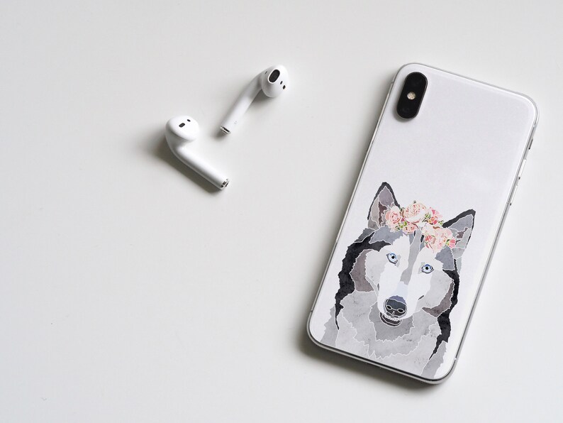 May include: White iPhone case with a watercolor illustration of a husky dog wearing a pink flower crown.