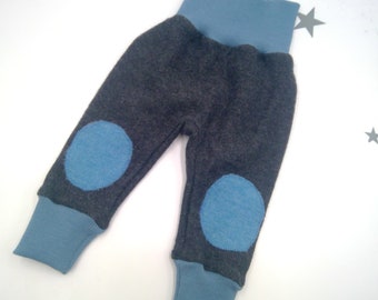 May include: Gray baby pants with blue knee patches and blue elastic waistband.