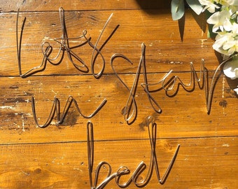 Wireword wall mount • bedroom decor • Wireword decor • Wall decor • wirewords • wirewords for bedroom • let’s stay in bed • positive quotes