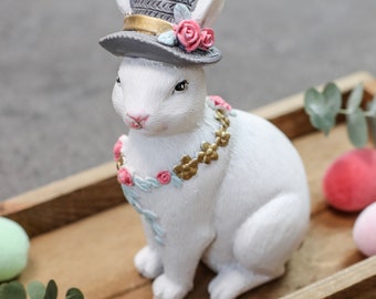 Spring decoration Poly rabbit with hat H 15 cm white