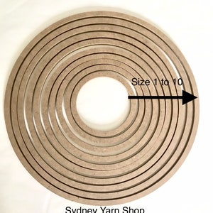 May include: Ten round, unfinished wood hoops, ranging in size from 1 to 10 inches in diameter. The hoops are arranged in a circle, with the smallest hoop in the centre and the largest hoop on the outside. The text "Size 1 to 10" is written above the hoops, and the text "Sydney Yarn Shop" is written below the hoops.