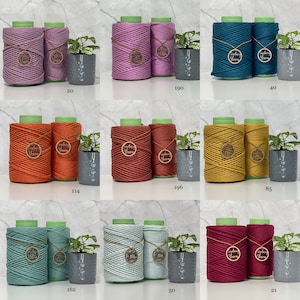 May include: Nine different colours of cotton rope, each wound into two spools, with a wooden tag that says "Sydney Yarn".