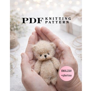 May include: A PDF knitting pattern document featuring a small, fuzzy, light beige knitted teddy bear with dark eyes and a dark nose. The text on the document reads PDF KNITTING PATTERN and ENGLISH +photos in a pink circle.