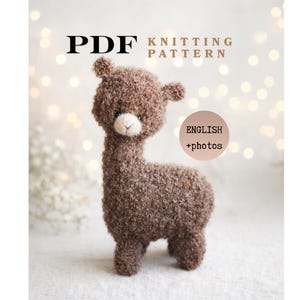 May include: A PDF knitting pattern featuring a brown, fuzzy, toy alpaca with a cream-colored muzzle. The text on the document reads PDF KNITTING PATTERN and ENGLISH +photos. The alpaca has a textured, curly appearance and small ears.