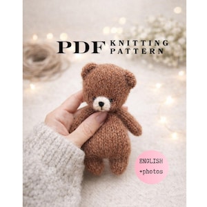 May include: A PDF knitting pattern for a small, fuzzy brown teddy bear with a cream-colored muzzle and a black nose. The document includes text that reads PDF KNITTING PATTERN and a pink circular badge stating ENGLISH +photos.
