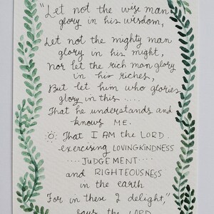 May include: A handwritten quote from Jeremiah 9:23-24, framed by a green watercolour vine border. The text is in black ink on a white background, with decorative corner accents. The quote emphasises wisdom, might, riches, and the Lord.