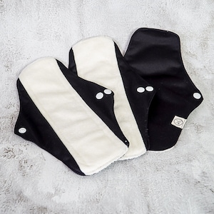 Compresas menstruales reutilizables (negras) - Talla regular para flujo medio