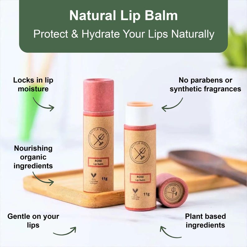 May include: Two tubes of Rose lip balm with a pink cap and a tan label, alongside a cap and a tube. The label reads "Battle Green" and "Rose Lip Balm". The text "Natural Lip Balm" and "Protect & Hydrate Your Lips Naturally" are at the top.