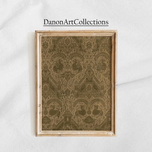May include: A framed print of a vintage, intricate, brown and gold patterned design. The pattern features repeating motifs of stylized flowers and leaves.
