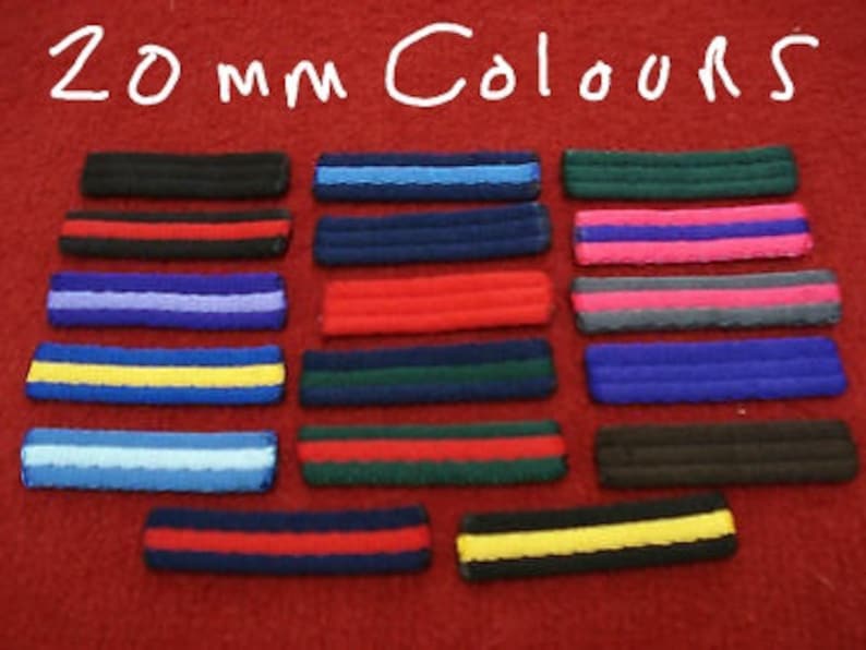 May include: A set of 20 mm wide fabric ribbon strips in various colors, including black, blue, red, yellow, green, and pink. The strips are arranged in rows, with each row featuring a different color combination.
