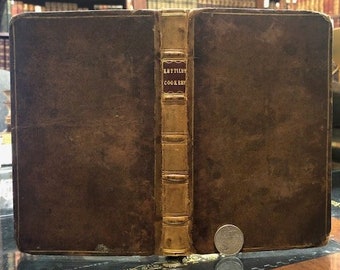 May include: A brown leather-bound book with gold accents and the title "Early English Cookery" on the spine.