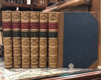 May include: A set of six antique books titled "Old & New London" with gold lettering and decorative patterns on the spines. The books are bound in brown leather and have a blue cloth cover.
