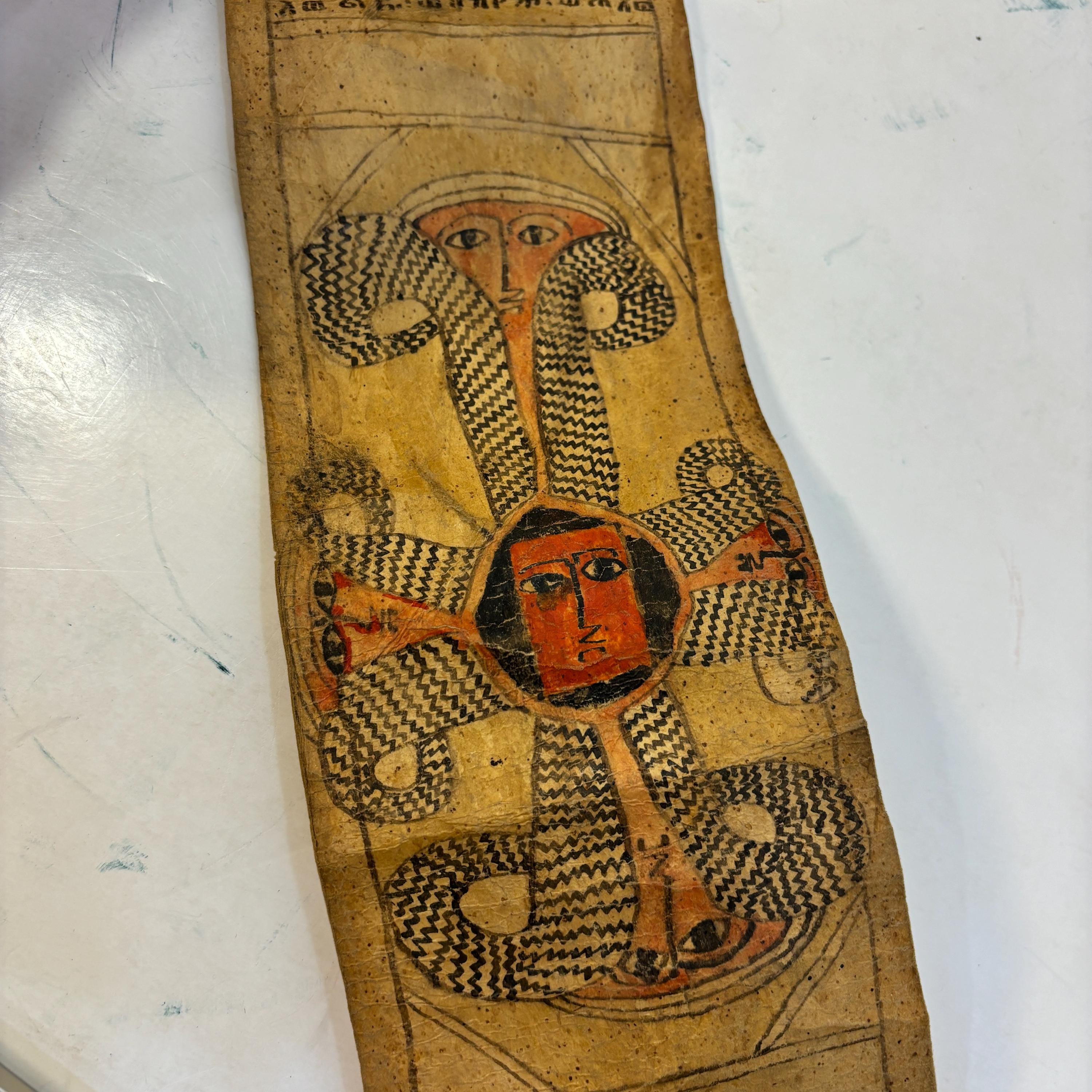 Ethiopian Manuscript Healing Scroll 4" x 82" with 3 images and 191 lines of text in three sheets of hide, connected with leather stitches — photograph 3.
