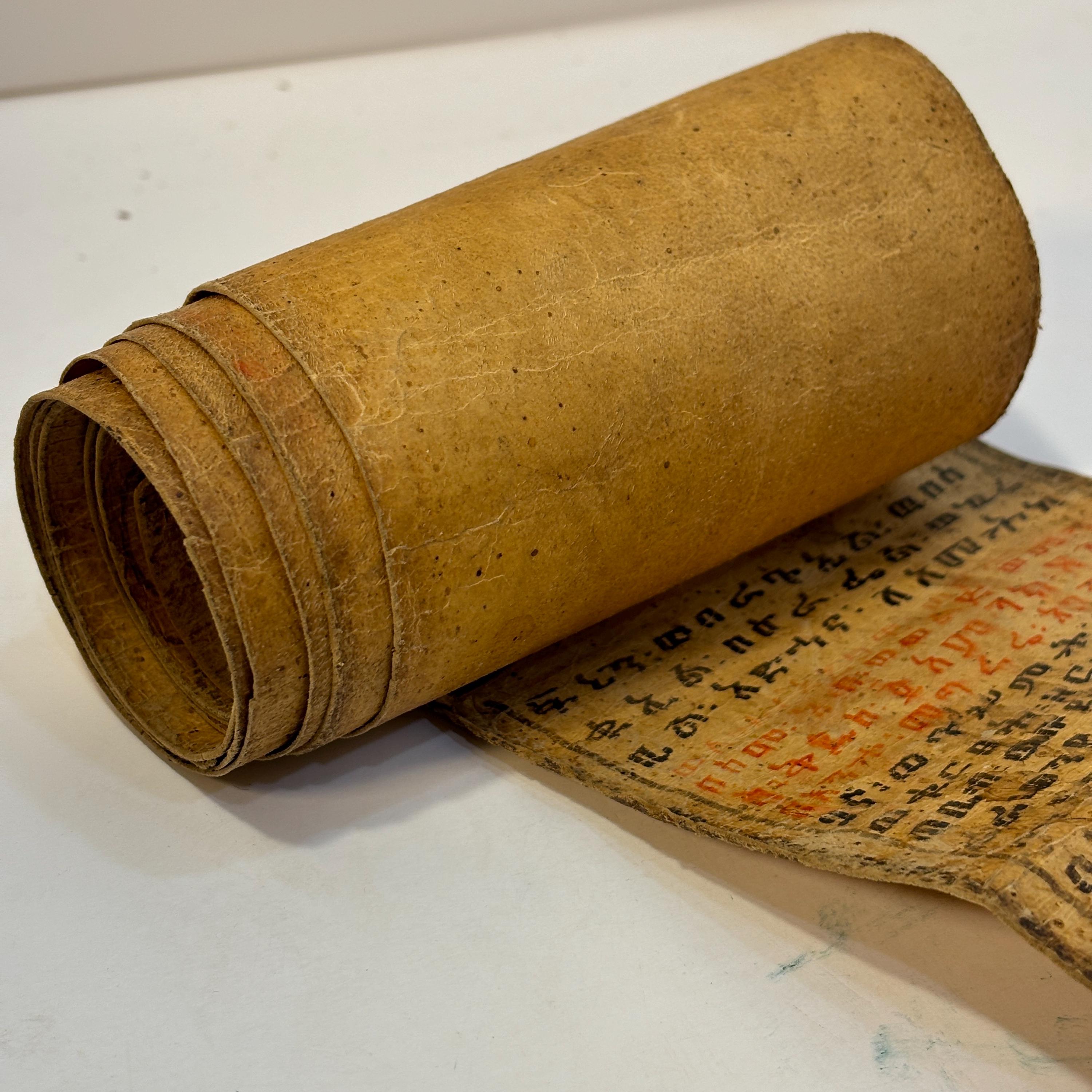 Ethiopian Manuscript Healing Scroll 4" x 82" with 3 images and 191 lines of text in three sheets of hide, connected with leather stitches — photograph 9.