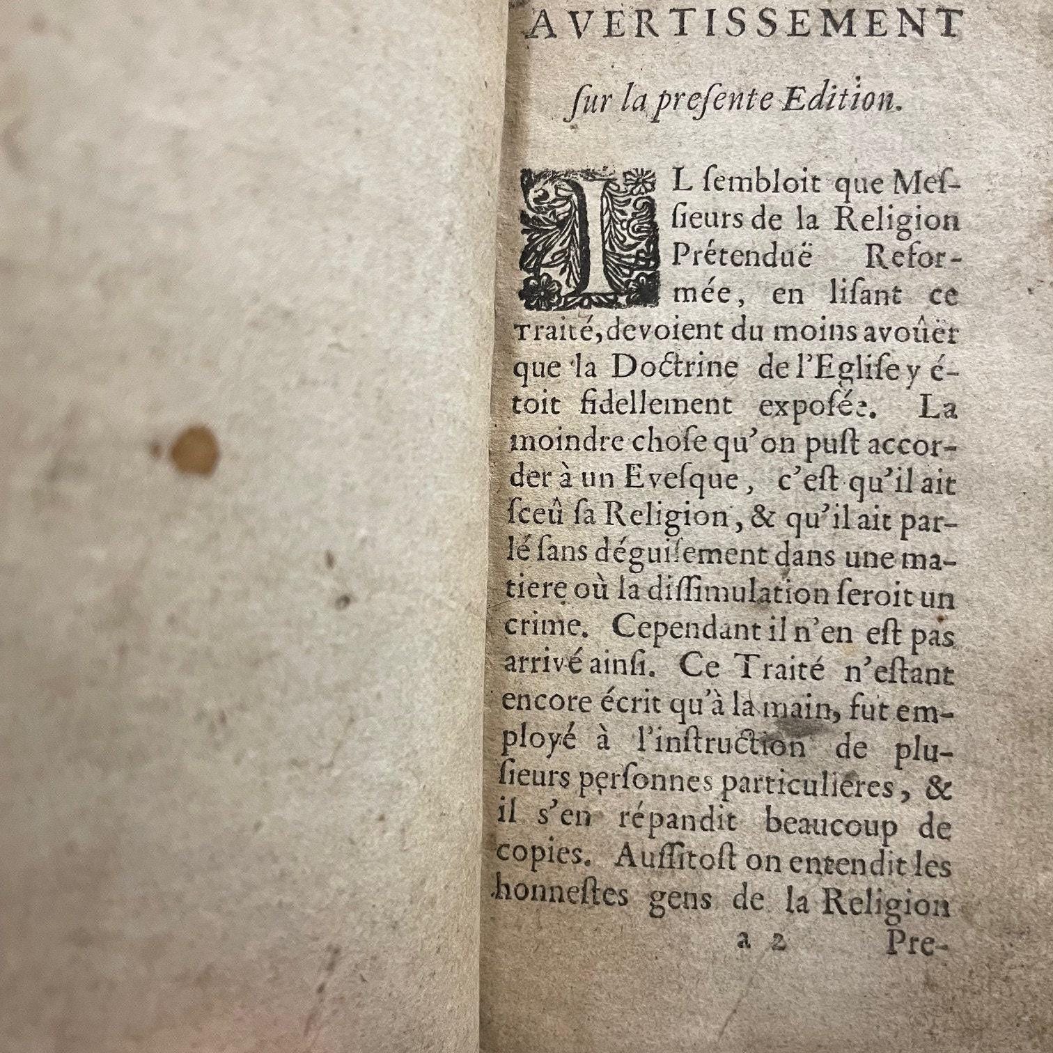 Exposition De La Doctrine De L'eglise Catholique Sue les Matieres de Controverse. Par Messire Jacques Benigne Bossuet... Derniere Edition --- AND --- Re'ponse Au Livre de Mr. de Condom Intitule', Exposition de la Doctrine de l'Eglise Catholique, sur les Matieres de Controverse. Par Mr. de Brueys, Avocat de Montpelier. Derniere Edition, dans lauelle les Pages citees du Livre de Monsieur de Condom, sont reglees sur l'impression de ce Pai's. Translated from French: Exposition of the Doctrine of the Catholic Church on Controversial Matters. By Messire Jacques-Bénigne Bossuet... Latest Edition --- AND --- Response to the Book by Mr. de Condom Entitled 'Exposition of the Doctrine of the Catholic Church on Controversial Matters.' By Mr. de Brueys, Lawyer from Montpellier. Latest Edition, in which the cited pages from Mr. de Condom's book are aligned with the printing of this country. — photograph 9.