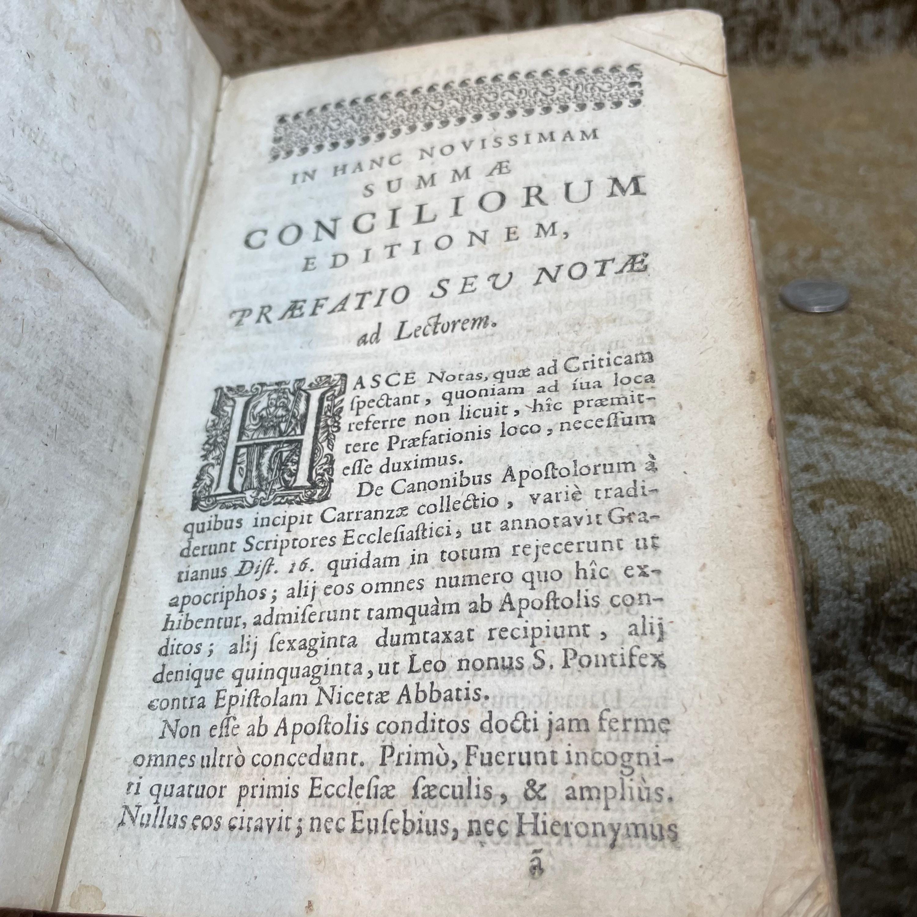SUMMA OMNIUM CONCILIORUM ET PONTIFICUM, collecta per F. Barth. Carranzam Miranden. Ordinis Praedicatorum. Accesserunt Statuta quaedam Synodalia Parisiensis & Senonensis Ecclesiae. Appendix Conciliorum Galliæ collectionis P. Sirmondi, & Societate Nominis Jesu Presbyteri. Et Annotationes quam-plurimae Francisci Sylvii sacrae Theologiae Doctoris ejusdemque in Universitate Duacena Regii Professoris, pro commoda locorum difficiliorum intelligentia. Additae sunt etiam nonnullae Annotationes in hac nova Editione, quarum maximam partem habes in Prolegomenis. Translated: Summary Of All Councils And Pontiffs, compiled by F. Barth. Carranza of Miranda, of the Order of Preachers. Certain statutes have been added from the Synods of the Churches of Paris and Sens. An Appendix of French Councils from the collection of P. Sirmond, a Priest of the Society of Jesus. And numerous annotations by Francis Sylvius, Doctor of Sacred Theology and Royal Professor at the University of Douai, for the convenience of understanding difficult passages. Also included are several annotations in this new edition, most of which can be found in the Prolegomena. — photograph 6.