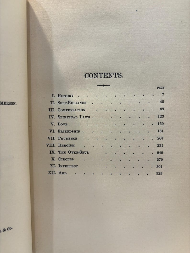 May include: A book's contents page, featuring a list of chapters and page numbers. The title "CONTENTS" is centered at the top. Chapter titles include "History," "Self-Reliance," and "Compensation." The page is aged with a cream color.