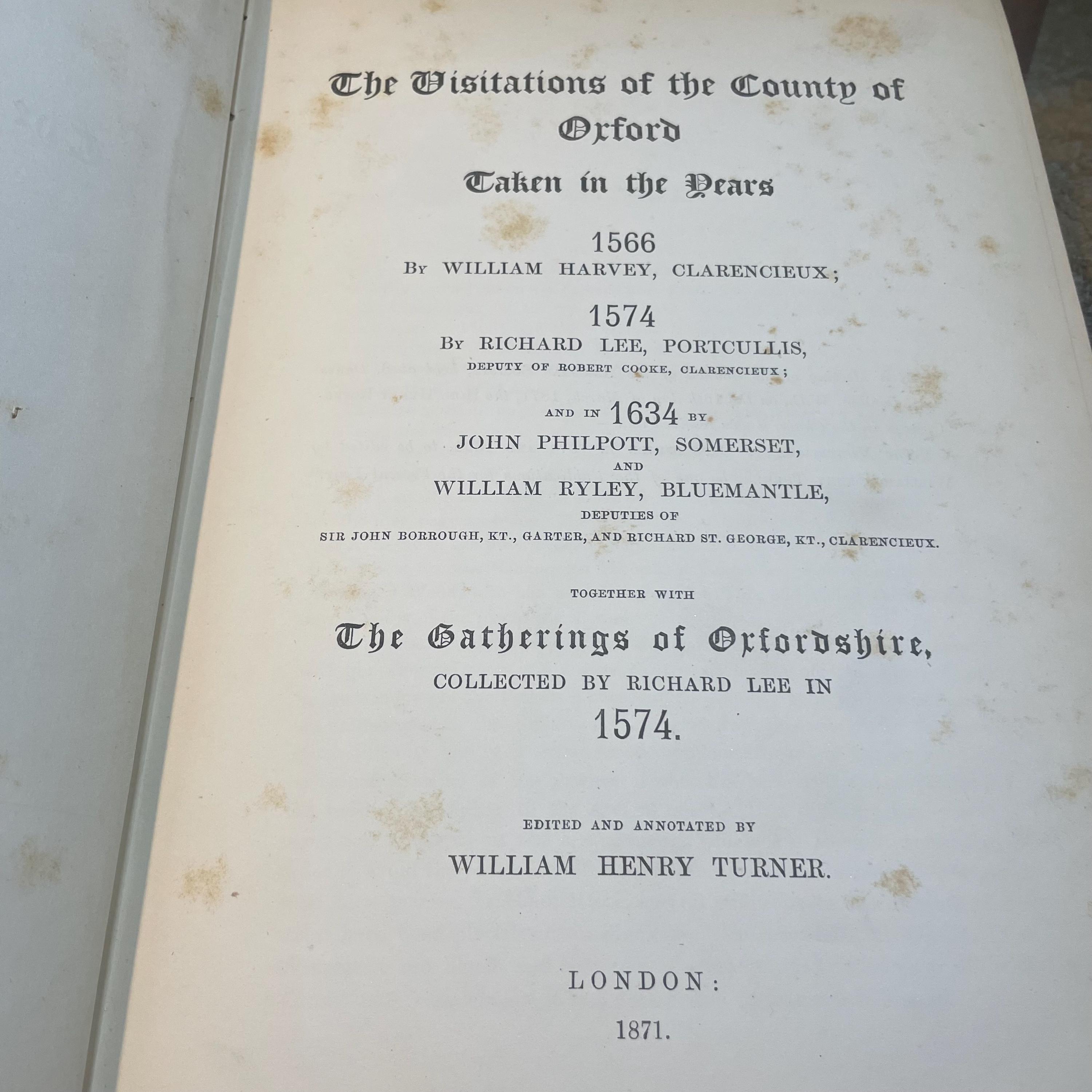 The Publications of The Harleian Society. Established A.D. 1869. Nine volumes comprising Vol.I.:The Visitation of London in the Year 1568. Taken by Robert Cooke…And Since Augmented Both With Descents and Arms. (London, 1869); Vol.II.: The Visitation of The Conty of Leicester In The Year 1619. Taken by William Camden.., Edited by John Fetherston. (London, 1870); Vol.III.:The Visitation of the County of Rutland In the Year 1618-19. Taken by William Camden... And Other Descents of Families Not in the Visitation. (London, 1870); Vol. IV.: The Visitations of The County of Nottingham In The Years 1569 and 1614, With Many other Descents of the Same County. Edited by George William Marshall, LL.M. (London, 1871); Vol. V.: The Visitations of The County of Oxford Taken in The Years 1566 by William Harvey, Clarencieux; 1574 by Richard Lee, Portcullis,.. and in 1634 by John Philpot, Somerset, and William Ryley, Bluemantle... Together with The Gatherings of Oxfordshire, Collected by Richard Lee in 1574. Edited and Annotated by William Henry Turner. (London, 1871); Vol. VI.: The Visitation of The County of Devon In The Year 1620. Edited by Frederic Thomas Colby (London, 1872); Vol.VII.: The Visitation of The County of Cumberland In The Year 1615. Taken by Richard St, George... Edited by John Fetherstone, F.S.A.(London, 1872); Vol. VIII.: Le Neve's Pedigrees of The Knights made By King Charles II., King James II., King William III. and Queen Mary, King William Alone, and Queen Anne. Edited by George w. Marshall, LL.D...(LOndon, 1873); Vol. IX.: The Visitation of the County of Cornwall, In The Year 1620. Edited by Lieut.-Colonel J.L. Vivian and Henry H. Drake, M.A., Ph.D....(London, 1874). Nine volumes total. — photograph 5.