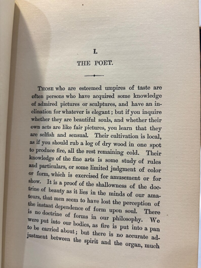 May include: An open book page with text. The title "THE POET" is at the top, followed by paragraphs of text. The paper is aged, with a slightly yellowed tone. The text is in black, with a serif font.
