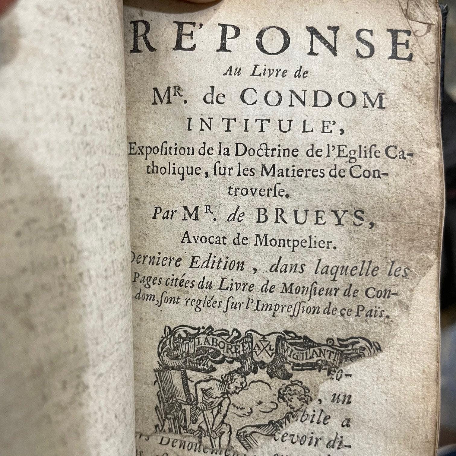 Exposition De La Doctrine De L'eglise Catholique Sue les Matieres de Controverse. Par Messire Jacques Benigne Bossuet... Derniere Edition --- AND --- Re'ponse Au Livre de Mr. de Condom Intitule', Exposition de la Doctrine de l'Eglise Catholique, sur les Matieres de Controverse. Par Mr. de Brueys, Avocat de Montpelier. Derniere Edition, dans lauelle les Pages citees du Livre de Monsieur de Condom, sont reglees sur l'impression de ce Pai's. Translated from French: Exposition of the Doctrine of the Catholic Church on Controversial Matters. By Messire Jacques-Bénigne Bossuet... Latest Edition --- AND --- Response to the Book by Mr. de Condom Entitled 'Exposition of the Doctrine of the Catholic Church on Controversial Matters.' By Mr. de Brueys, Lawyer from Montpellier. Latest Edition, in which the cited pages from Mr. de Condom's book are aligned with the printing of this country. — photograph 4.