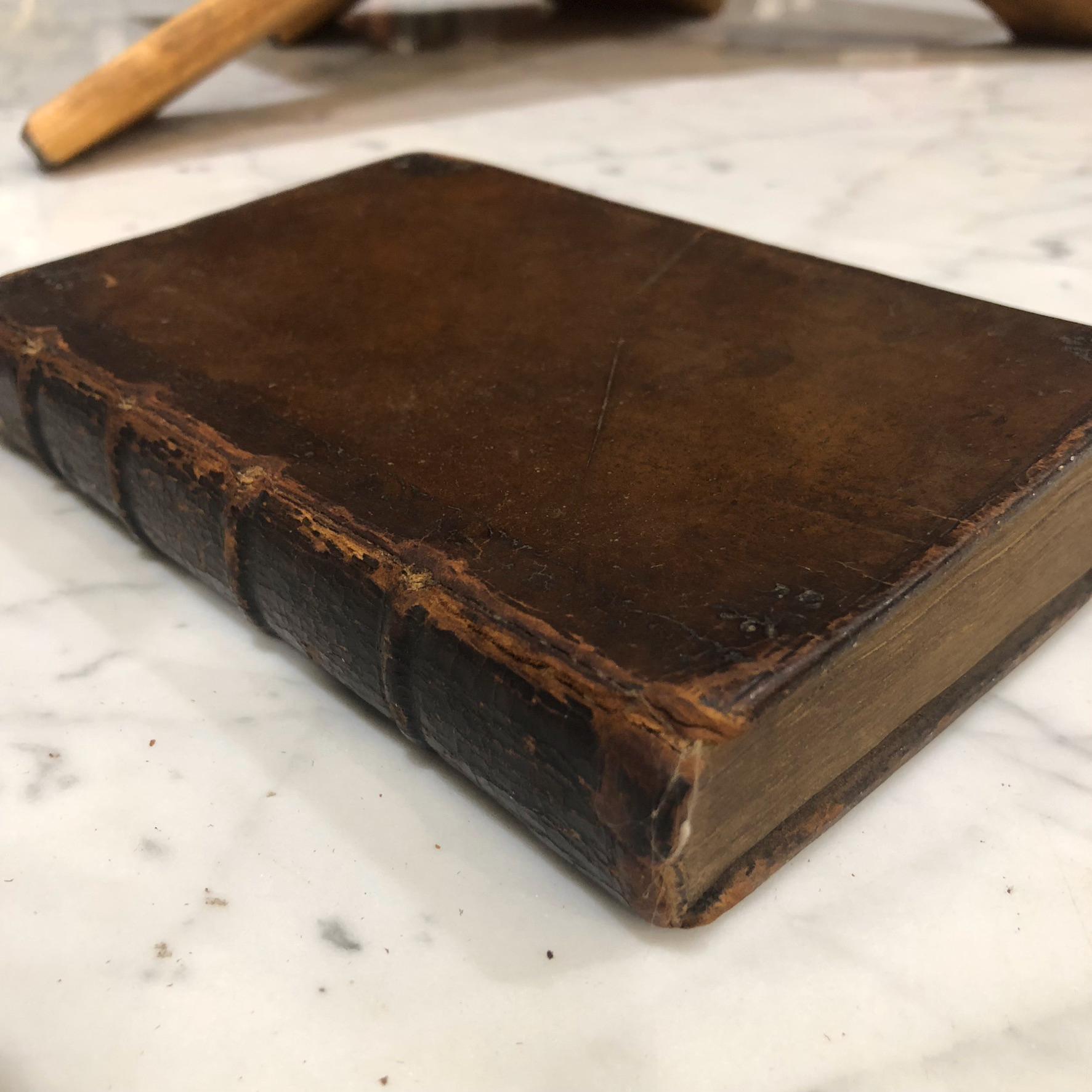 Hugo Grotius De Veritate Religionis Christianæ. Editio accuratior, Quam secundum recensuit, notulisque illustravit Joannes Clericus; cujus accessit De eligenda inter Christianos dissidentes Sententia, Liber Unicus. Translated: Hugo Grotius On The Truth Of The Christian Religion. A more accurate edition, Which has been revised a second time, and illustrated with notes by Johannes Clericus; to which has been added On choosing among Christians who disagree, An opinion, A single book. — photograph 8.