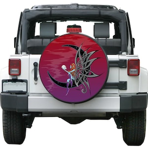May include: A spare tire cover with a colorful design featuring a fairy sitting on a crescent moon with a skull in her hand. The background is a gradient of red, purple, and black.