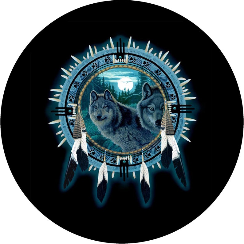 May include: Two grey wolves are depicted in a blue and white dreamcatcher design. The wolves are looking out of the dreamcatcher, which is surrounded by feathers. The background is black.