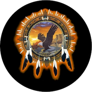 May include: A Native American dreamcatcher with a sunset scene and a bald eagle in flight. The dreamcatcher is decorated with feathers and beads.