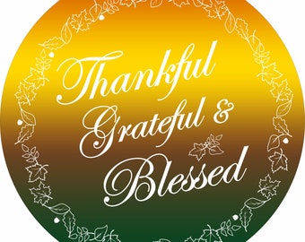 May include: A round, gradient background with a wreath of leaves in white. The text "Thankful Grateful & Blessed" is written in white cursive font.