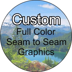 May include: A round sticker with a mountain scene and the text "Custom Full Color Seam to Seam Graphics".