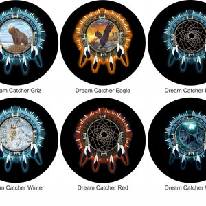 May include: Six different dream catcher designs with various animal images. The dream catchers are circular with a web-like pattern in the center and feathers hanging from the bottom. The animals include a bear, eagle, wolf, and a winter scene.