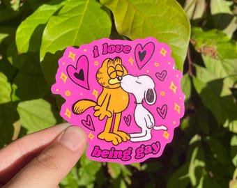 Pegatina del Orgullo Gay: Gato y perro naranja besándose - Pegatina brillante resistente al agua