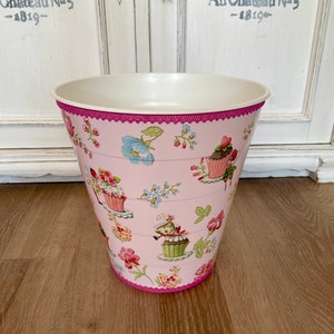 wastepaper basket, trash can, garbage can, toy, storage