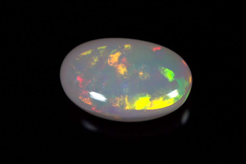 14.40 Carats Ethiopian White OPAL Lots of Play of Color. 22 x 13 mm Size