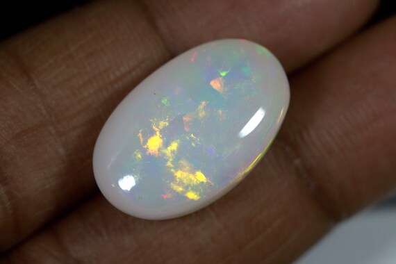 14.40 Carats Ethiopian White OPAL Lots of Play of Color. 22 x 13 mm Size