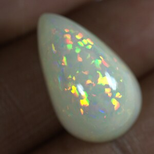 14.40 Carats Ethiopian White OPAL Lots of Play of Color. 22 x 13 mm Size