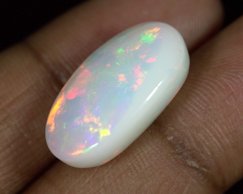 14.40 Carats Ethiopian White OPAL Lots of Play of Color. 22 x 13 mm Size