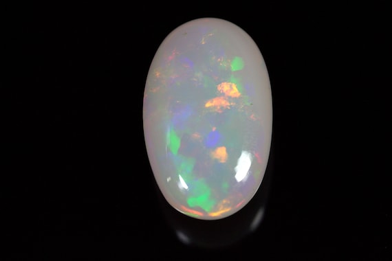 14.40 Carats Ethiopian White OPAL Lots of Play of Color. 22 x 13 mm Size