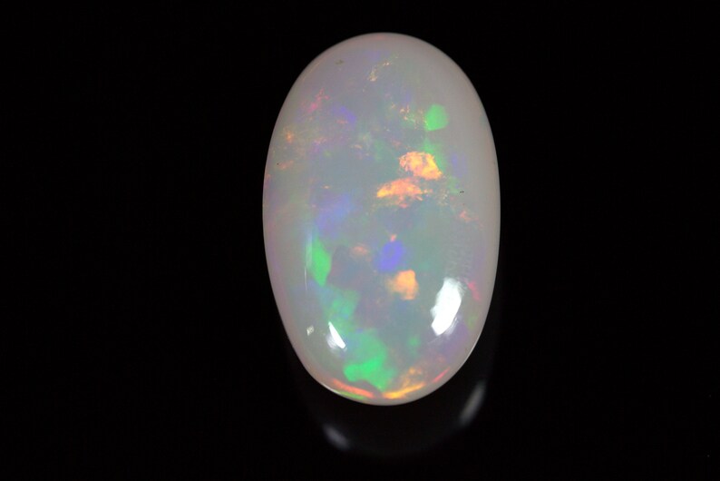 14.40 Carats Ethiopian White OPAL Lots of Play of Color. 22 x 13 mm Size