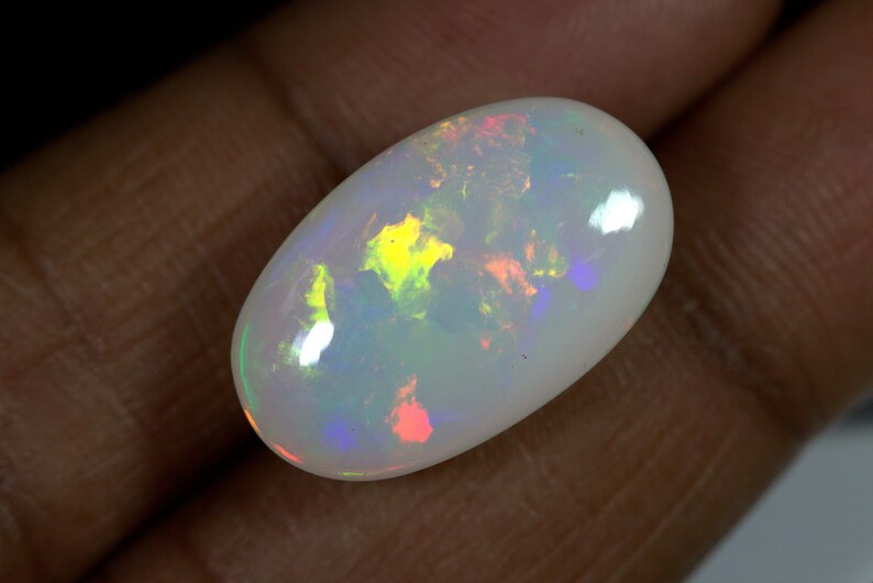 14.40 Carats Ethiopian White OPAL Lots of Play of Color. 22 x 13 mm Size