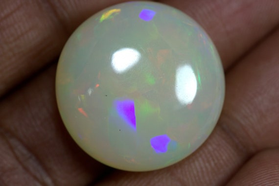 14.40 Carats Ethiopian White OPAL Lots of Play of Color. 22 x 13 mm Size
