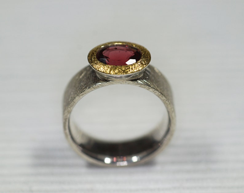 Garnet ring with wide rail